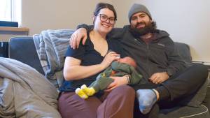 Jamie-Lee and Brayden Klassen pictured with their newborn doughter Theia Joyce Klassen, the first baby of 2026 delivered at Whitehorse General Hospital. (Jim Elliot/Yukon News)
