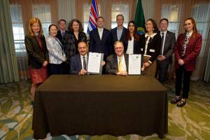 B.C. Speaker Raj Chouhan, front left, and Washington State Lt.-Gov. Denny Heck in Vancouver Thursday, Jan. 8, 2026 after signing a new agreement for cross-border collaboration. (@LtGovDennyHeck/x)