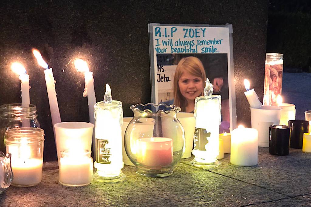More than 60 people gathered in Langley City's Douglas Park Sunday for a candlelight vigil and moment of silence to honour the victims of the Tumbler Ridge shootings and the memory of Zoey Benoit, who studied at a local school. (Dan Ferguson/Langley Advance Times)